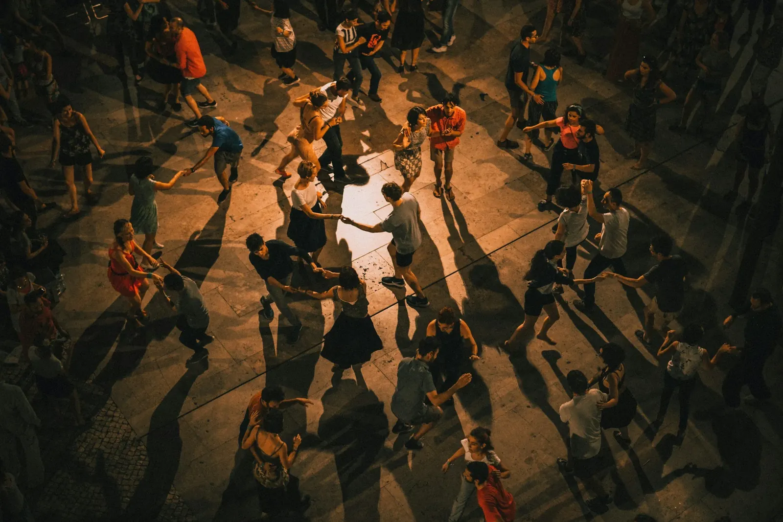 People gathered in a circle of light